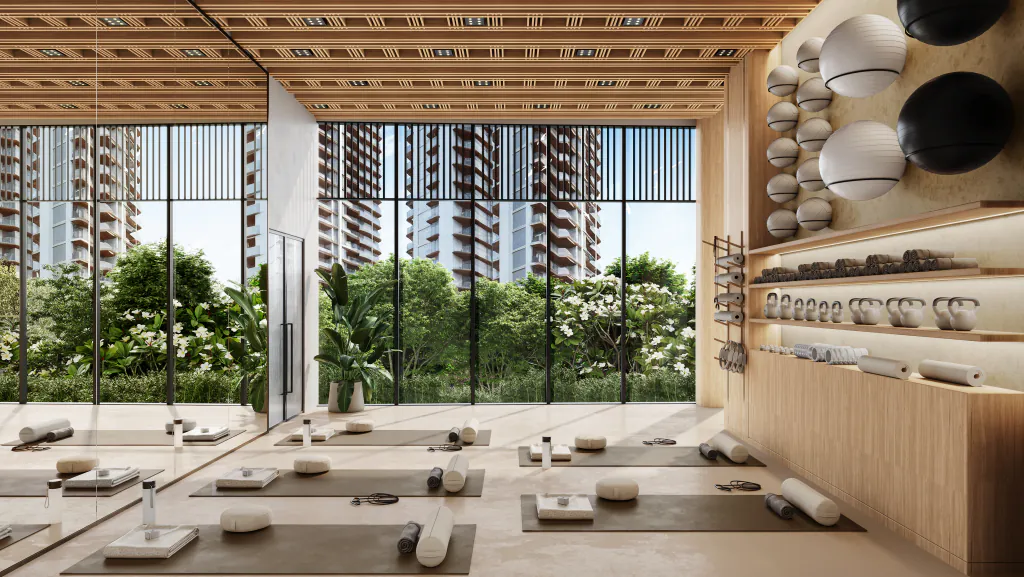 The yoga room at Eldeco 7 Peaks Residences — mats laid out on the floor, kettlebells and rollers on timber shelving, and full-height glazing that looks back at the towers. Developer's artistic impression.